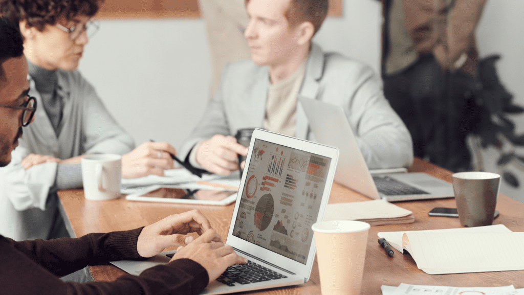 business movers in LA men woman conference desk laptop