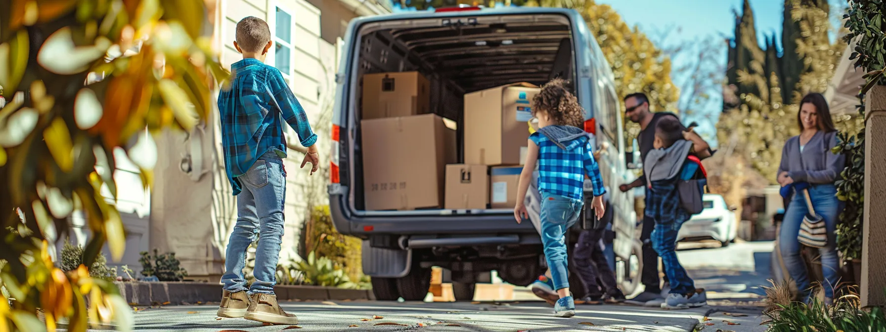a family happily watching professional movers load their belongings onto a moving truck in los angeles, ensuring a stress-free and successful relocation. a family happily watching professional movers load their belongings onto a moving truck in los angeles, ensuring a stress-free and successful relocation.