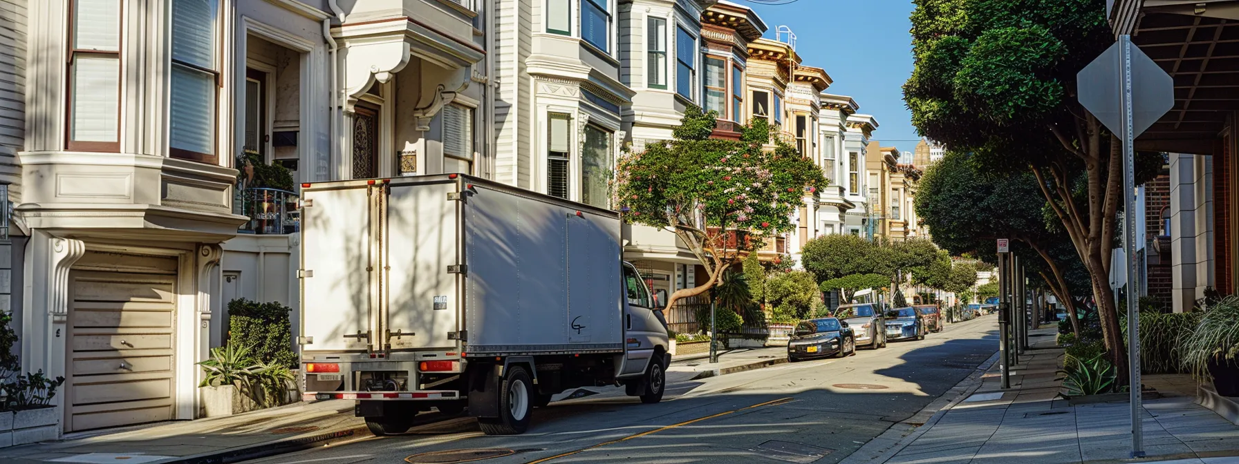 a moving truck parked by a row of victorian houses on a narrow street in downtown san francisco, with homeowners discussing parking permits and navigating logistics. a moving truck parked by a row of victorian houses on a narrow street in downtown san francisco, with homeowners discussing parking permits and navigating logistics.