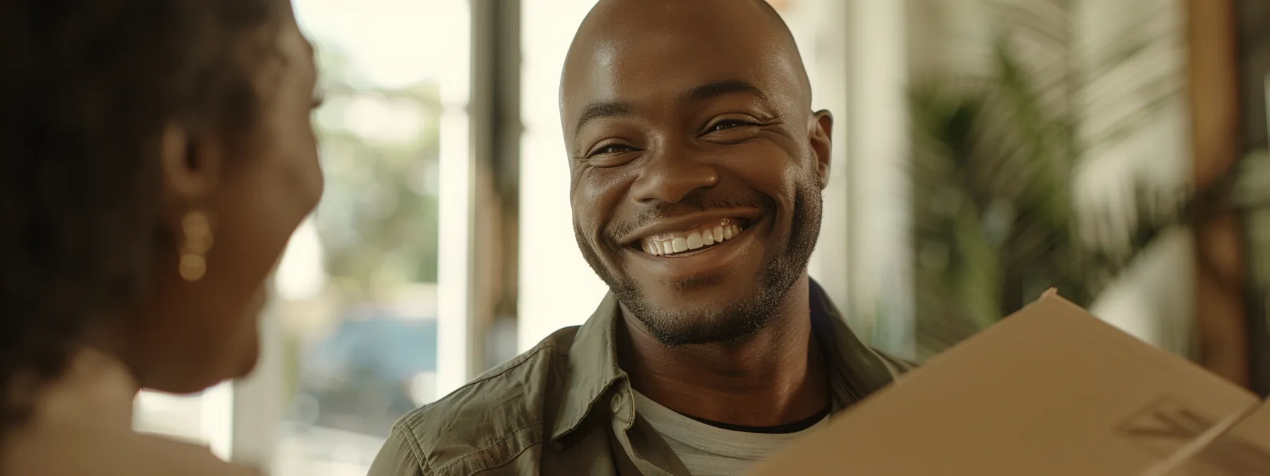 a person smiling while receiving a discounted moving quote from a local orange county moving company.