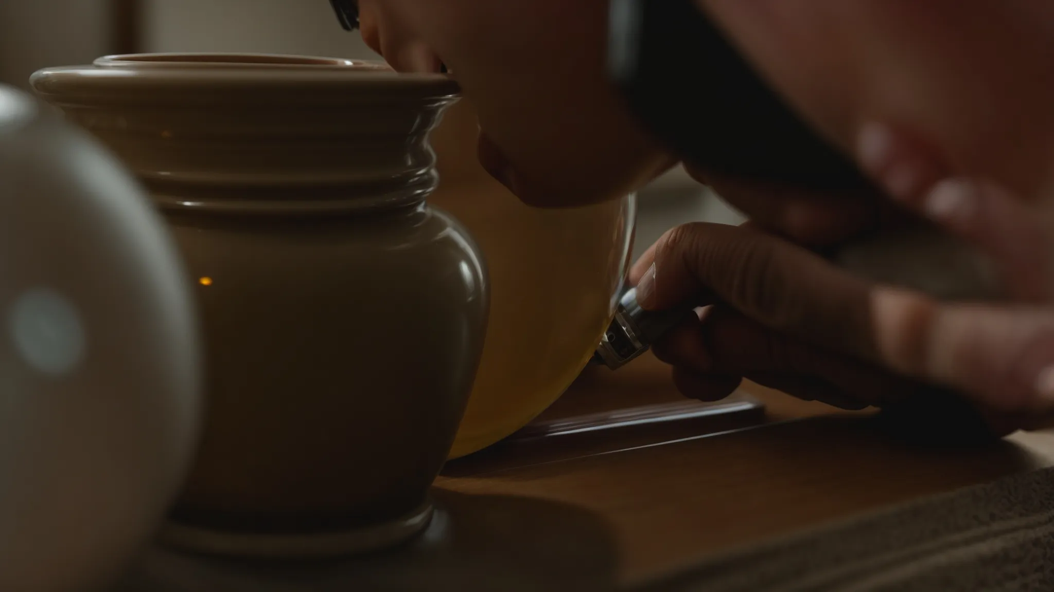 a professional mover carefully wrapping a delicate antique vase for secure transportation in irvine, ca (lat: 33.6846, long: -117.8265).